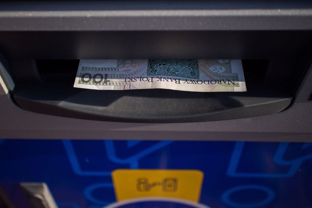 Atm dispensing a bank note