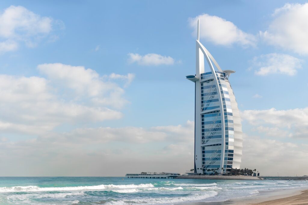 An iconic building in Dubai called Burj Al Arab which structure is designed to mimic the sail of the ship