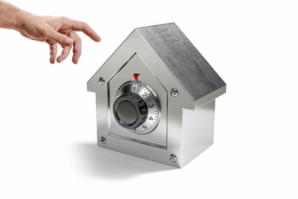 Hand reaching to a locked safe