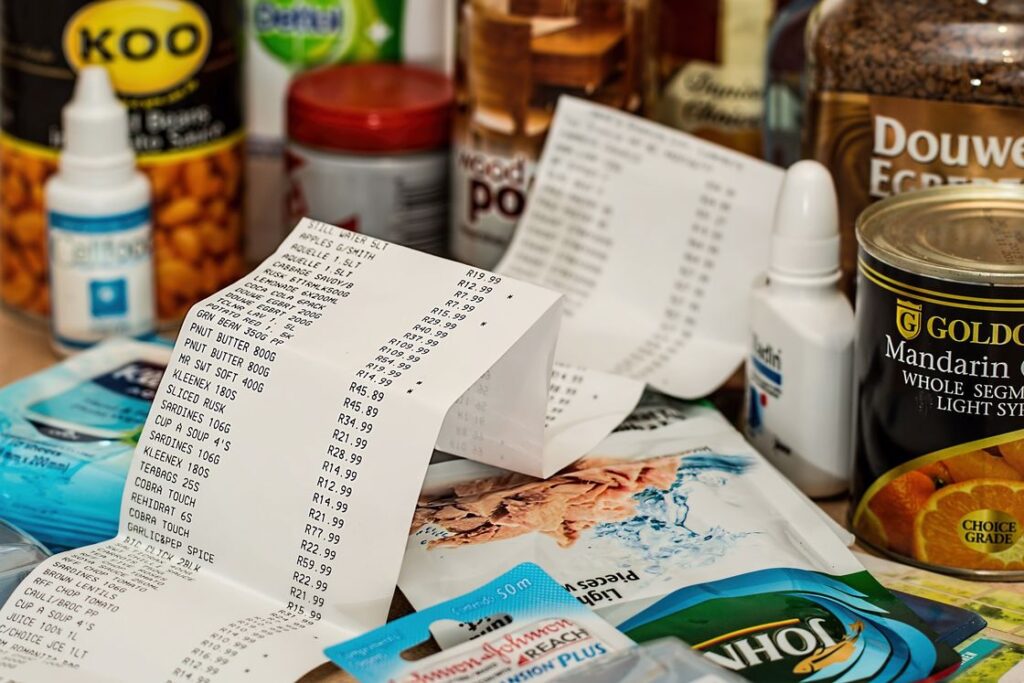 Long grocery receipt placed on the center of purchased products